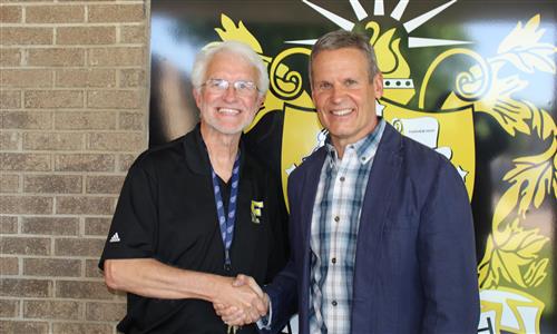 Man shakes hands with Governor Bill Lee